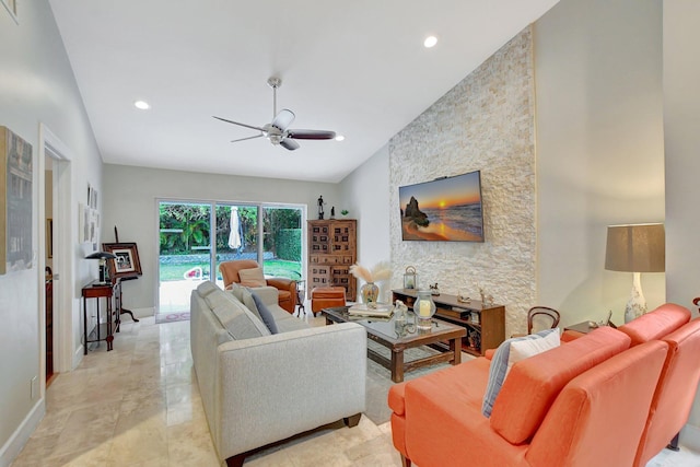 living room featuring ceiling fan and lofted ceiling