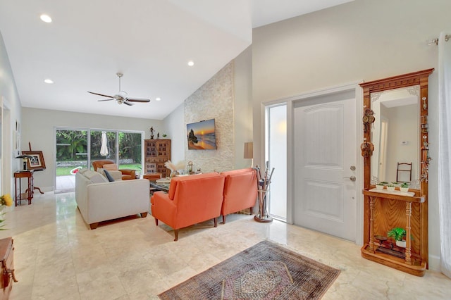 living room featuring high vaulted ceiling and ceiling fan