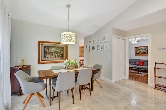 dining room featuring lofted ceiling and ceiling fan