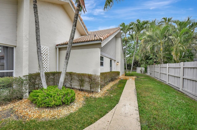 view of home's exterior featuring a yard