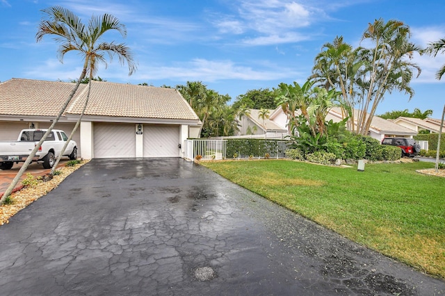 exterior space with a front yard and a garage