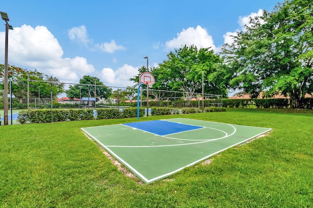 view of basketball court with a lawn and volleyball court