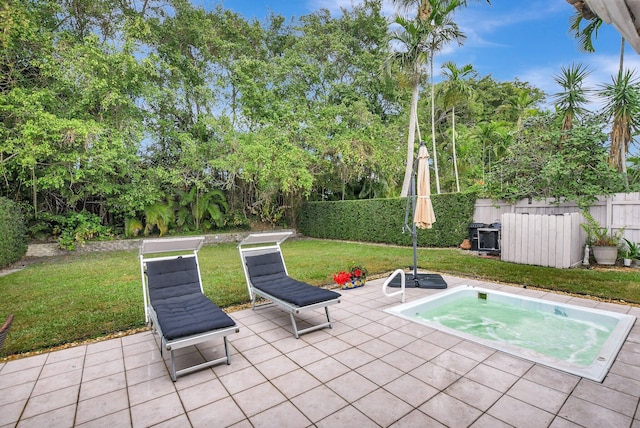 view of patio / terrace featuring an in ground hot tub