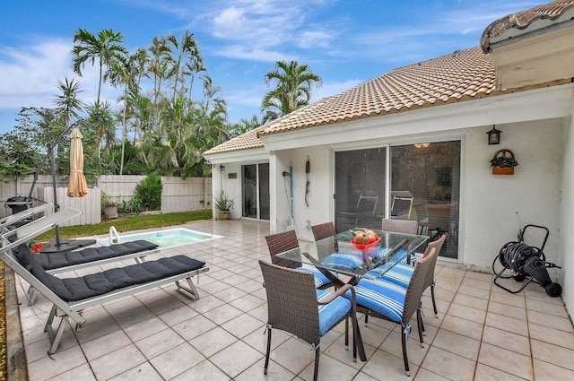 view of patio / terrace featuring a fenced in pool