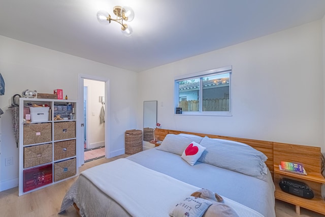 bedroom with light hardwood / wood-style flooring