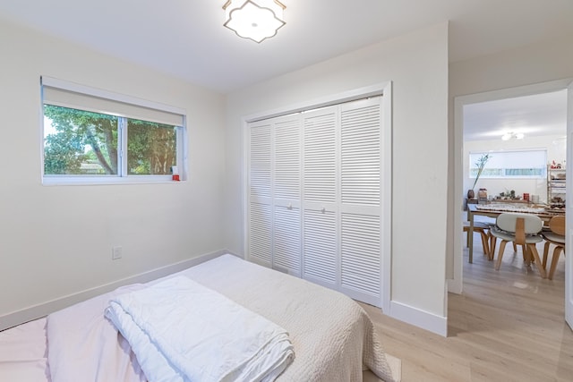 bedroom featuring light hardwood / wood-style flooring and a closet