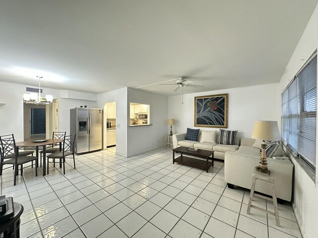 tiled living room featuring ceiling fan