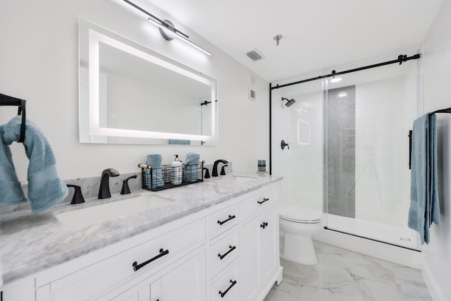 bathroom featuring a shower with shower door, toilet, and vanity