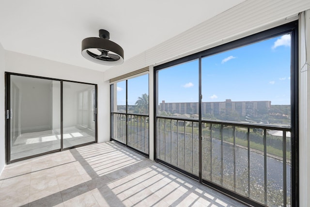unfurnished sunroom featuring a city view