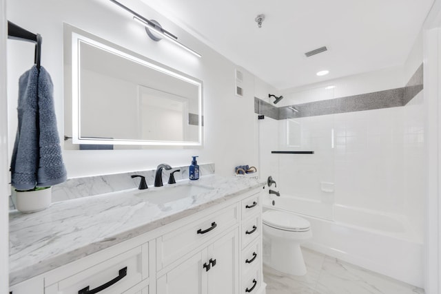 bathroom with toilet, vanity,  shower combination, marble finish floor, and visible vents