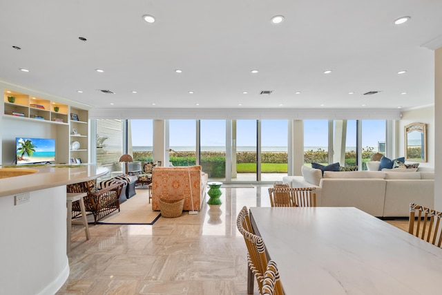 dining area featuring floor to ceiling windows