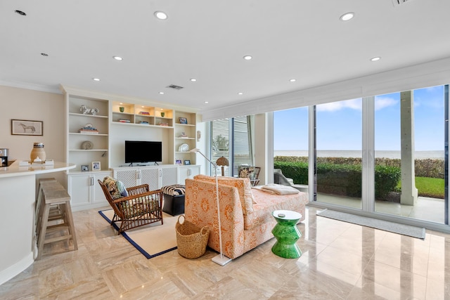 living room featuring ornamental molding and built in features