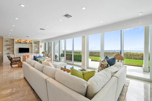 living room with built in features and a wealth of natural light