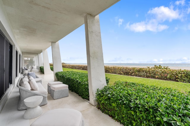 view of patio with a water view