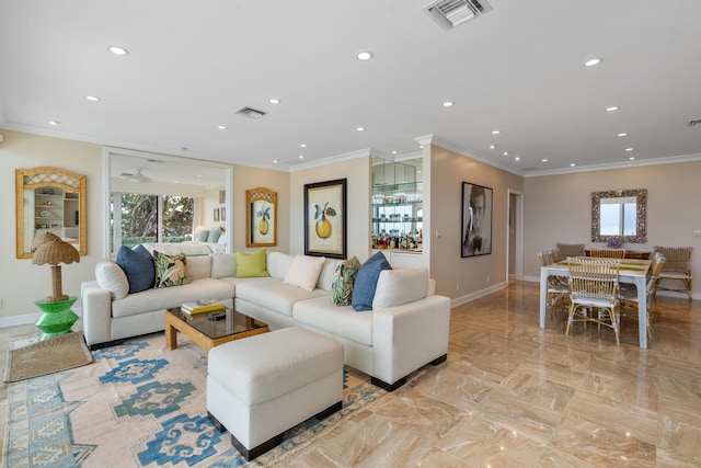 living room featuring crown molding