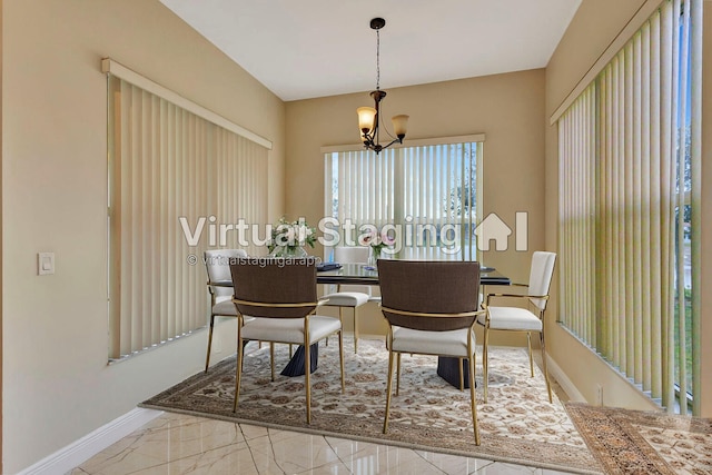 dining room featuring a notable chandelier