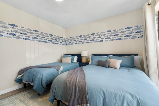 bedroom with wood-type flooring