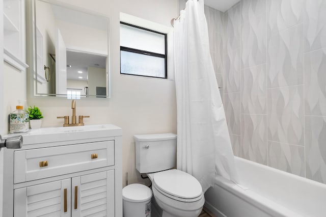 full bathroom with toilet, vanity, and shower / bath combo with shower curtain