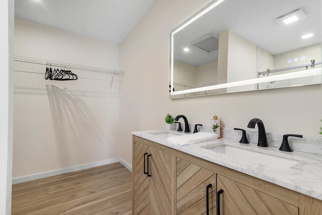 bathroom with wood-type flooring and vanity