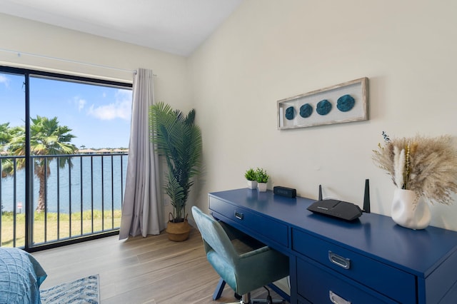 office featuring a water view and light wood-type flooring