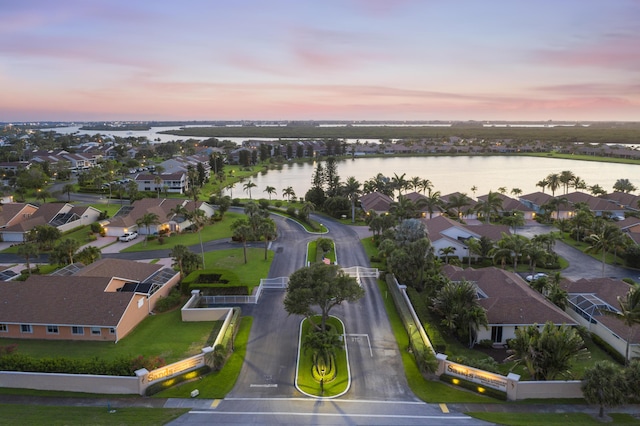 aerial view at dusk with a water view