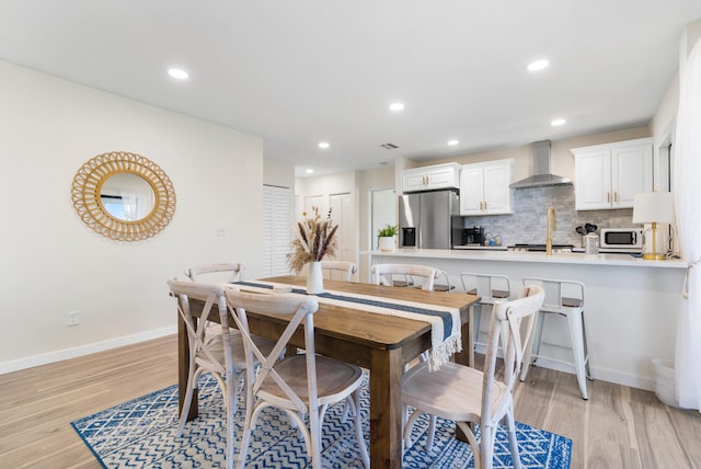 dining space featuring light hardwood / wood-style floors