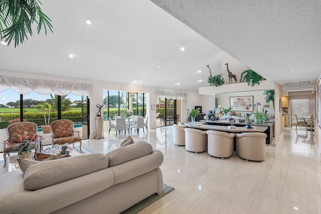 tiled living room with a textured ceiling