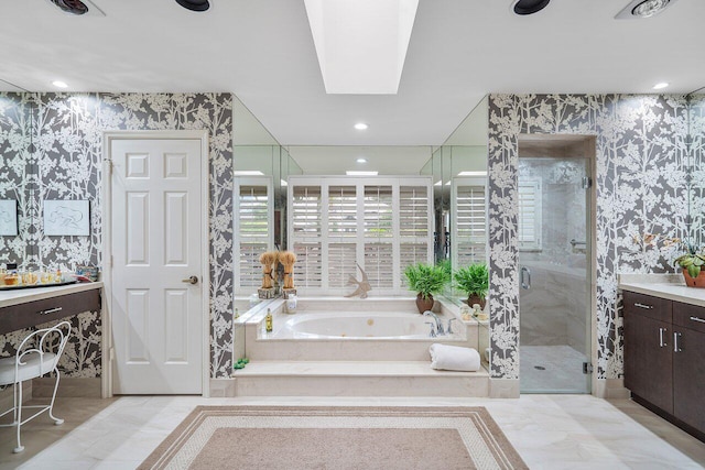 bathroom featuring vanity and separate shower and tub