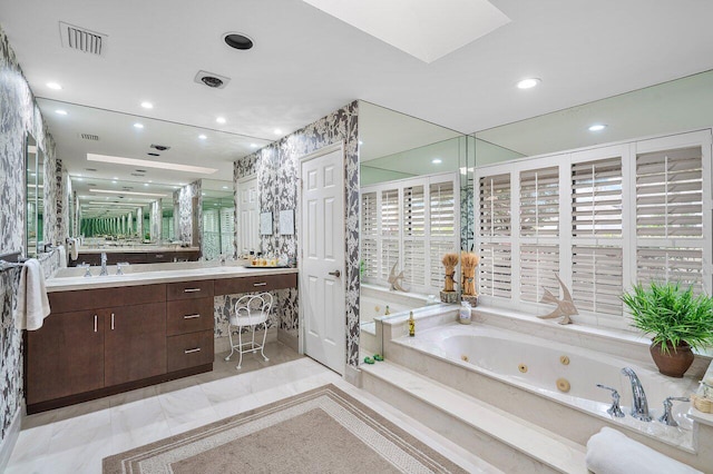 bathroom featuring a bathing tub and vanity