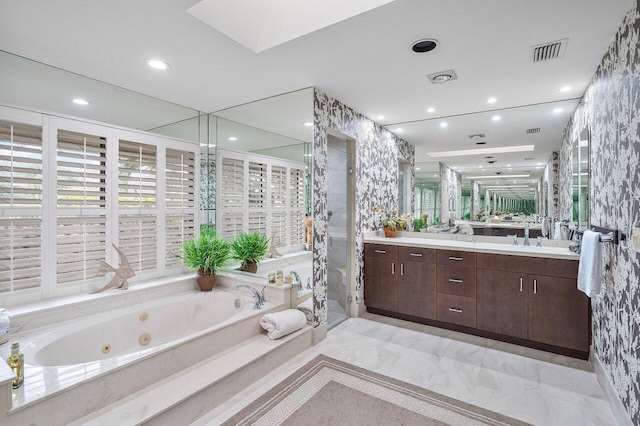 bathroom with vanity and plus walk in shower