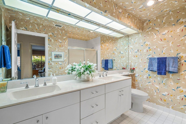 bathroom with toilet, walk in shower, tile patterned floors, and vanity