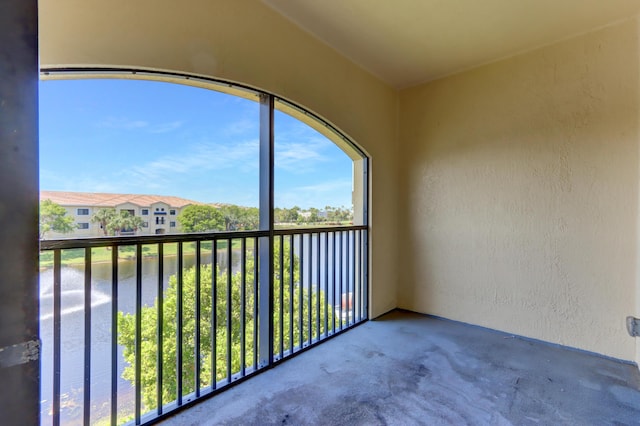 unfurnished sunroom with a water view