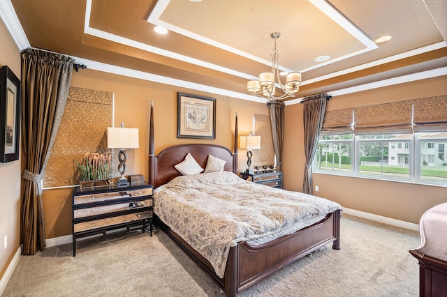 carpeted bedroom with crown molding, a raised ceiling, and a chandelier