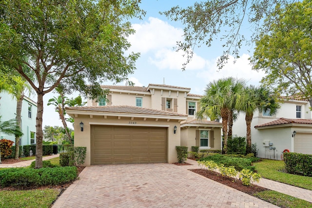 mediterranean / spanish-style home with a garage