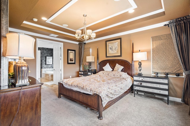 carpeted bedroom with crown molding, a tray ceiling, ensuite bathroom, and a chandelier