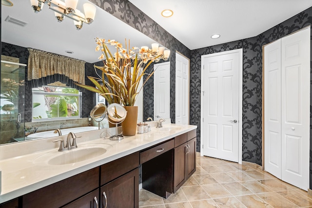 bathroom with vanity, tile patterned flooring, and a shower with door