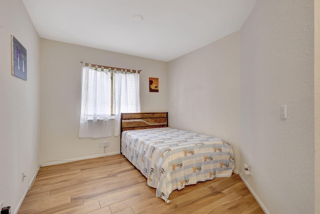 bedroom featuring light wood-type flooring