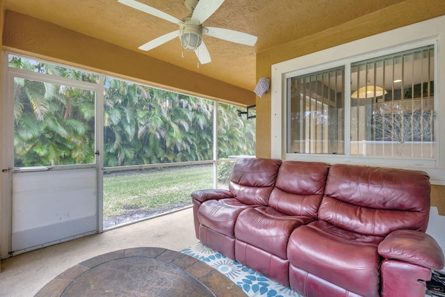 sunroom / solarium featuring ceiling fan