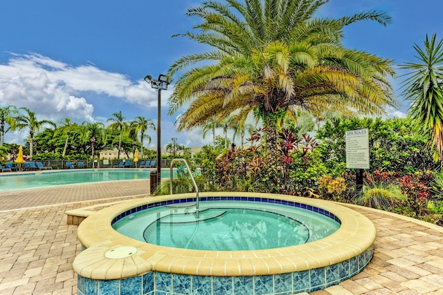 view of pool featuring a community hot tub