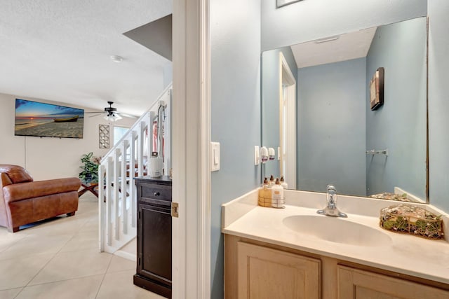 bathroom featuring ceiling fan, tile patterned floors, and vanity