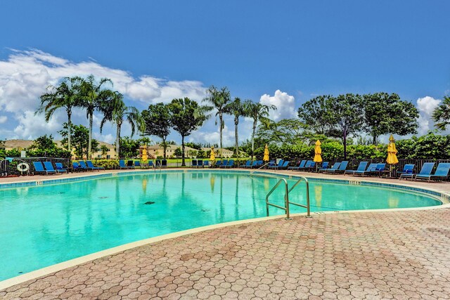 view of property's community featuring a yard and a playground