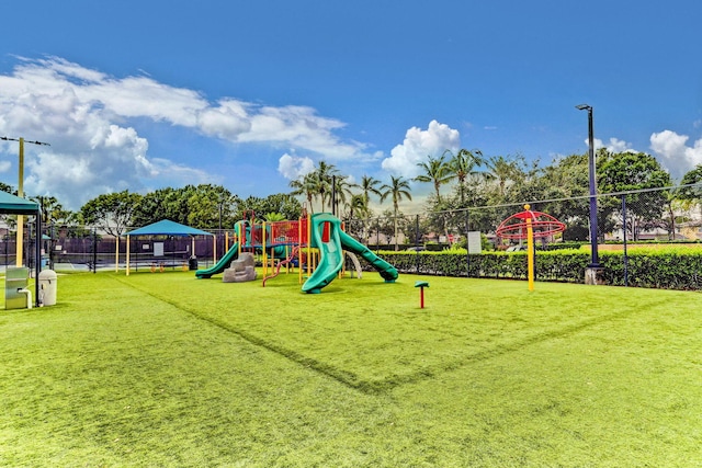 view of playground featuring a lawn