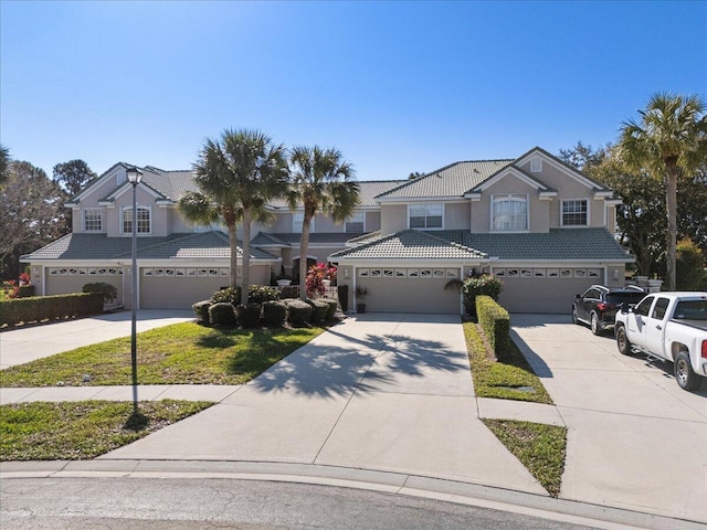 front of property with a garage