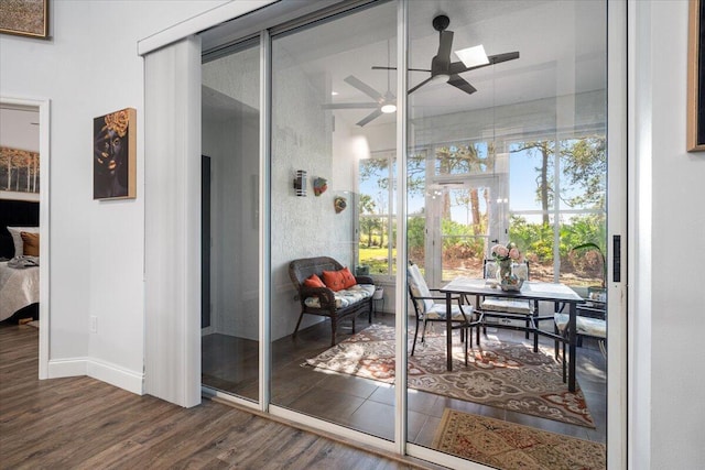 interior space featuring ceiling fan and dark hardwood / wood-style flooring