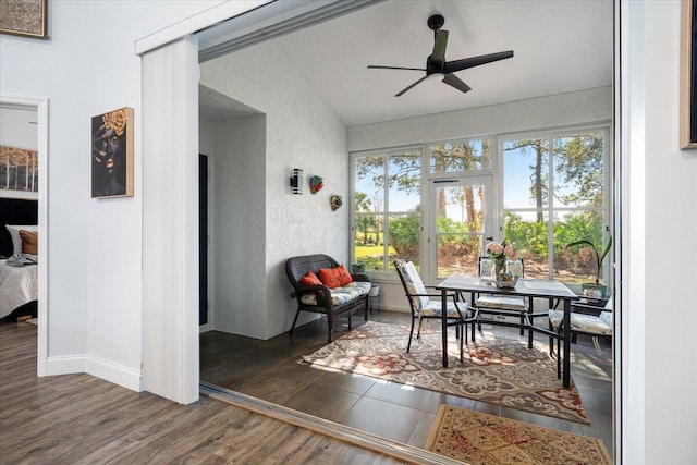 sunroom featuring ceiling fan, plenty of natural light, and vaulted ceiling