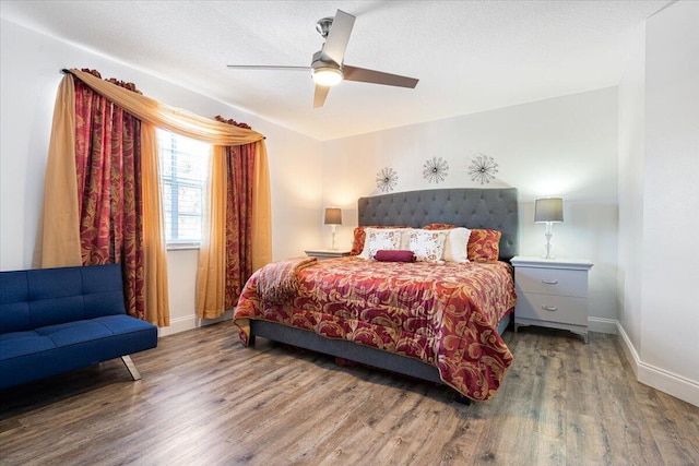 bedroom featuring ceiling fan and wood-type flooring