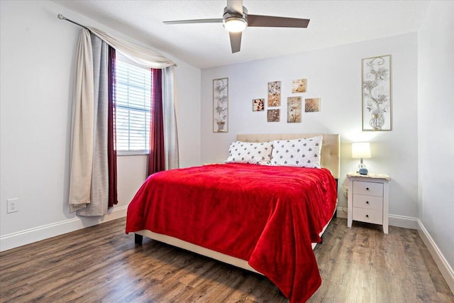 bedroom featuring dark hardwood / wood-style flooring and ceiling fan