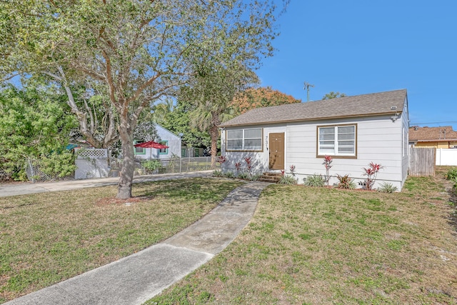 bungalow with a front yard