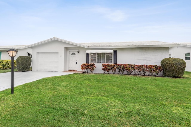 single story home featuring a garage and a front lawn