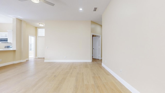 unfurnished room featuring ceiling fan and light hardwood / wood-style floors